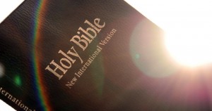 A375PX Holy Bible with lens flare and rainbow.